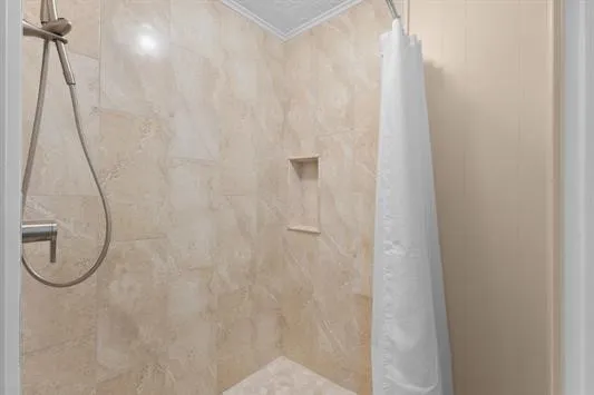 a view of a kitchen cabinets and a refrigerator
