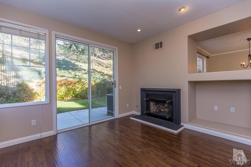 524 Shadow Lane Simi Valley, CA 93065 - Photo 12 of 40 a view of an empty room with wooden floor and a window