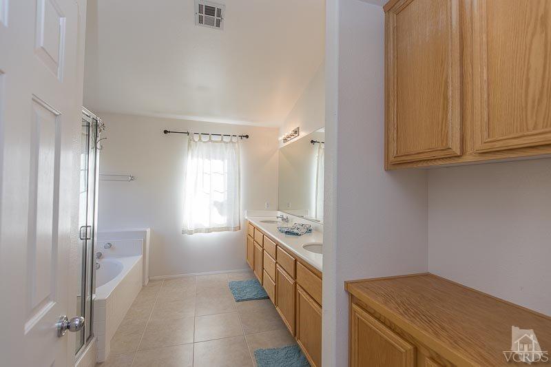 524 Shadow Lane Simi Valley, CA 93065 - Photo 15 of 40 a kitchen with granite countertop a refrigerator and a sink