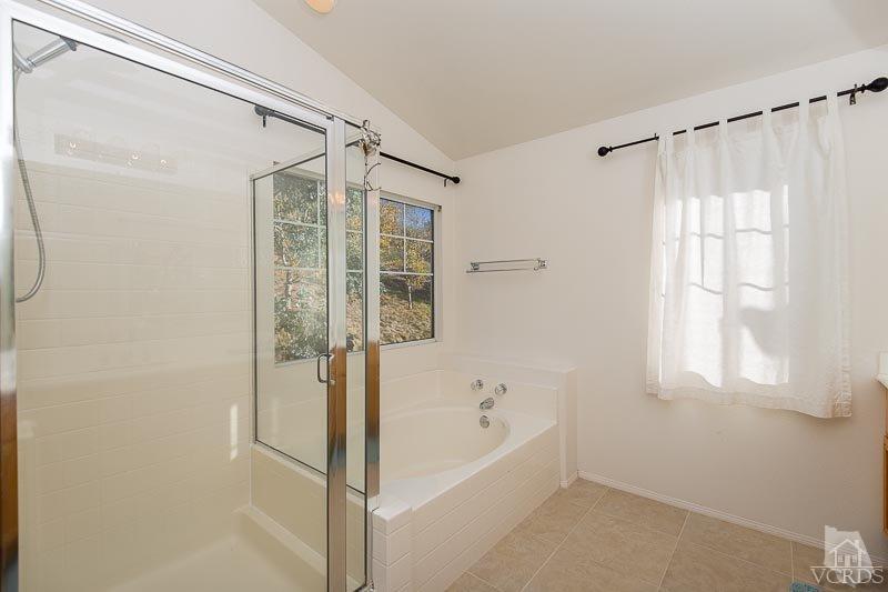 524 Shadow Lane Simi Valley, CA 93065 - Photo 17 of 40 a bathroom with a bathtub and a shower