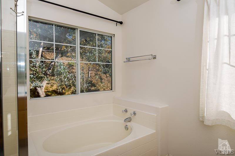 524 Shadow Lane Simi Valley, CA 93065 - Photo 20 of 40 a bathroom with bathtub and shower