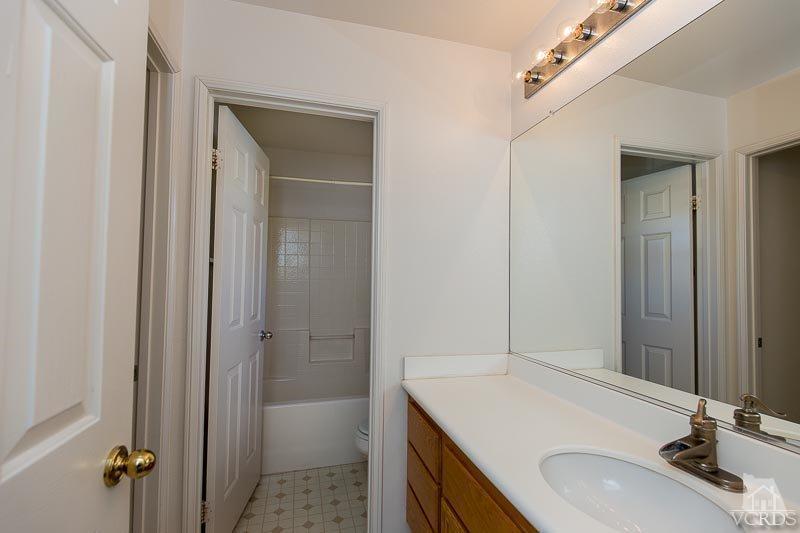 524 Shadow Lane Simi Valley, CA 93065 - Photo 22 of 40 a bathroom with a sink and a mirror