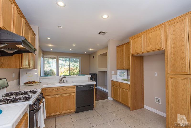 524 Shadow Lane Simi Valley, CA 93065 - Photo 7 of 40 a kitchen with a sink appliances and cabinets