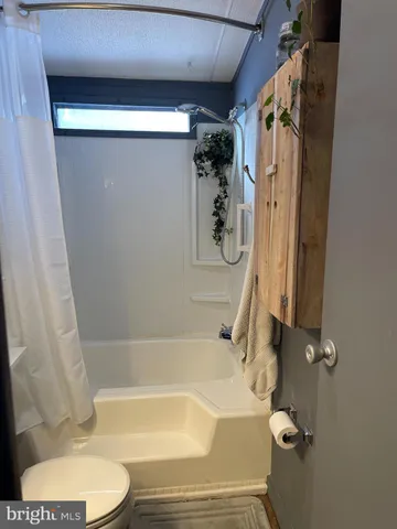 a bathroom with a tub and a shower