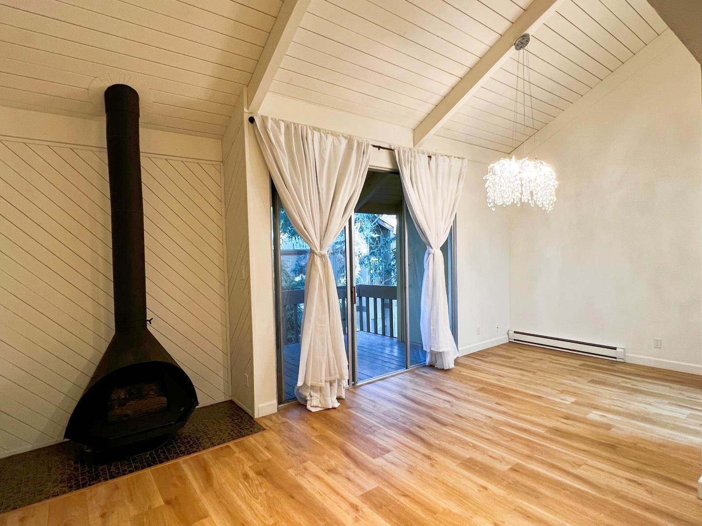 505 Cypress Point Drive, Unit 231 Mountain View, CA 94043 - Photo 13 of 17 a view of empty room with wooden floor and fan