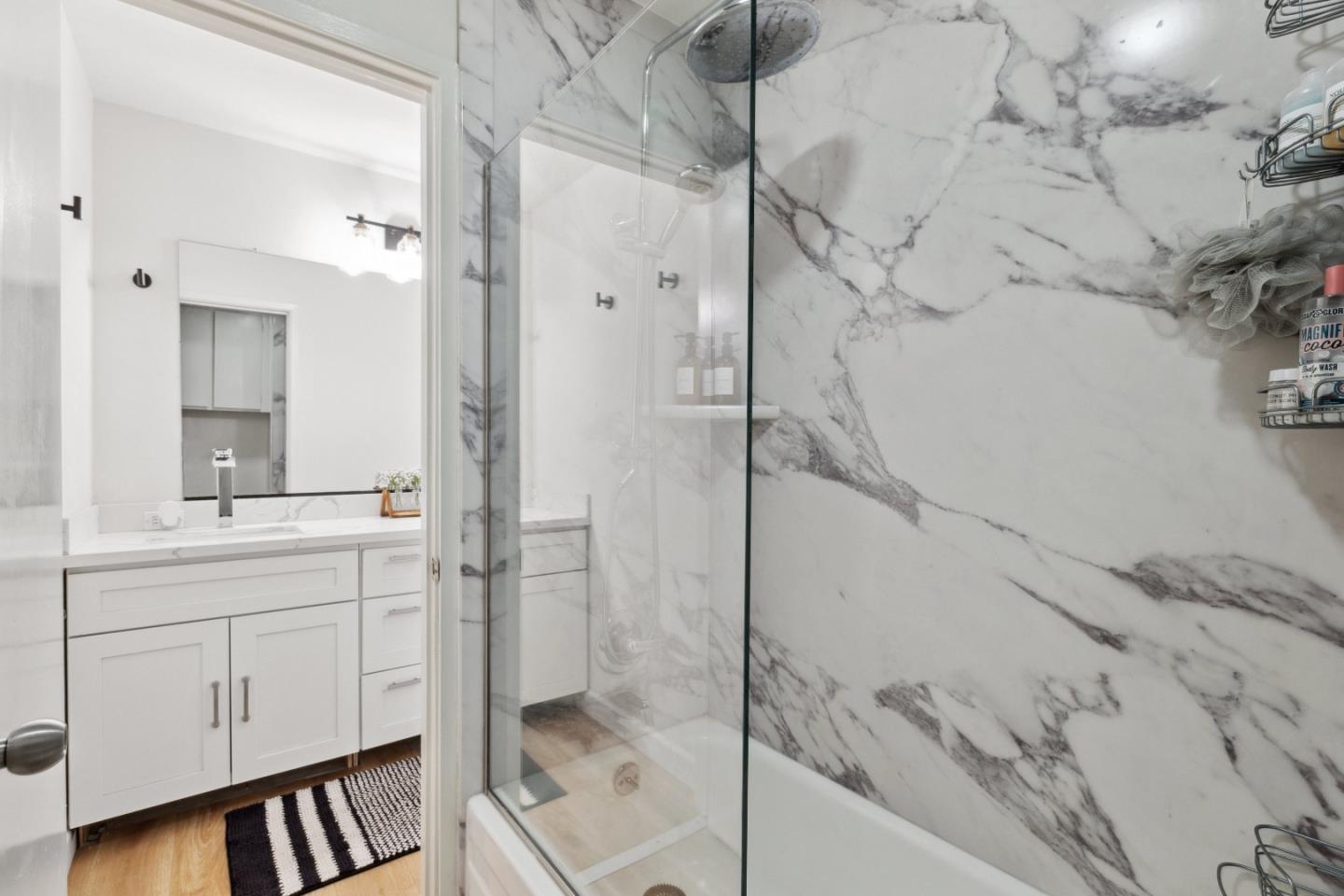 505 Cypress Point Drive, Unit 231 Mountain View, CA 94043 - Photo 3 of 17 a spacious bathroom with a shower and a sink