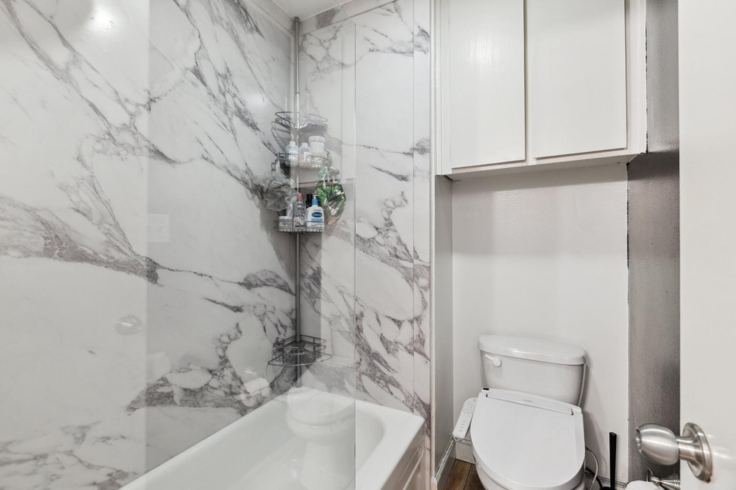 505 Cypress Point Drive, Unit 231 Mountain View, CA 94043 - Photo 4 of 17 a bathroom with a toilet and shower