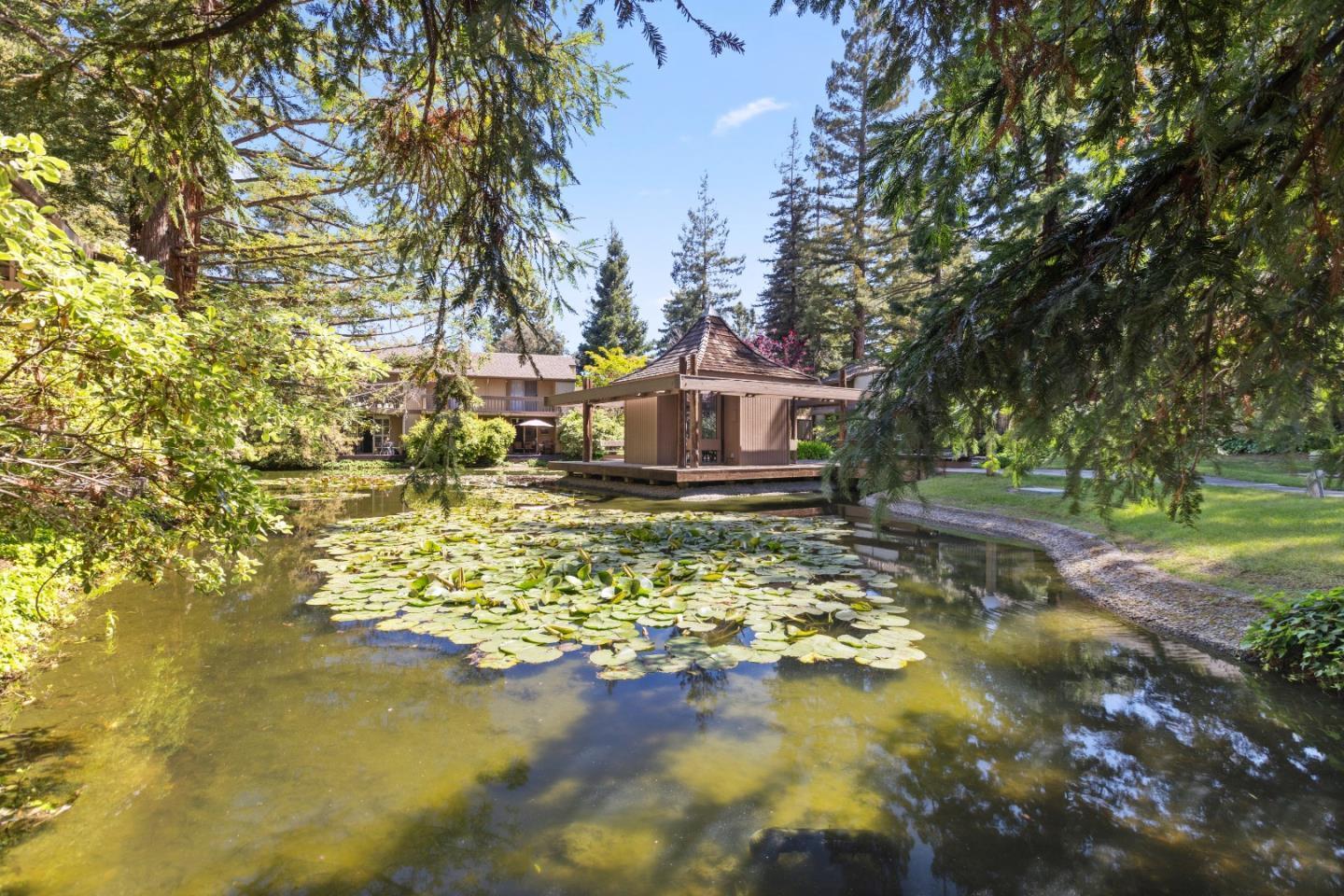 505 Cypress Point Drive, Unit 231 Mountain View, CA 94043 - Photo 10 of 17 a front view of a house with a yard swimming pool and outdoor seating