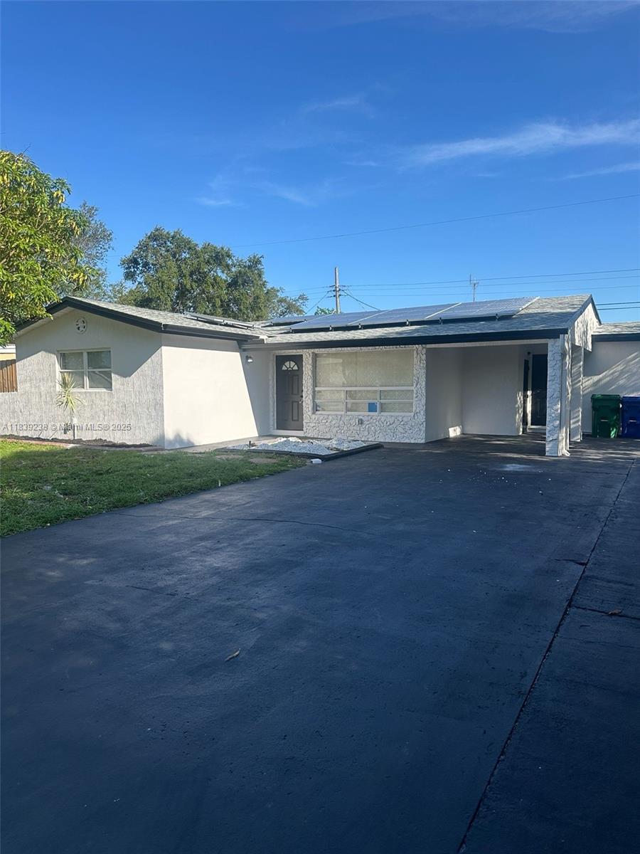 6990 Southwest 28th Street Miramar, FL 33023 - Photo 1 of 33 front view of a house with a street