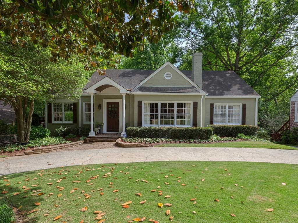 453 East Wesley Road Northeast Atlanta, GA 30305 - Photo 1 of 1 a front view of a house with a yard