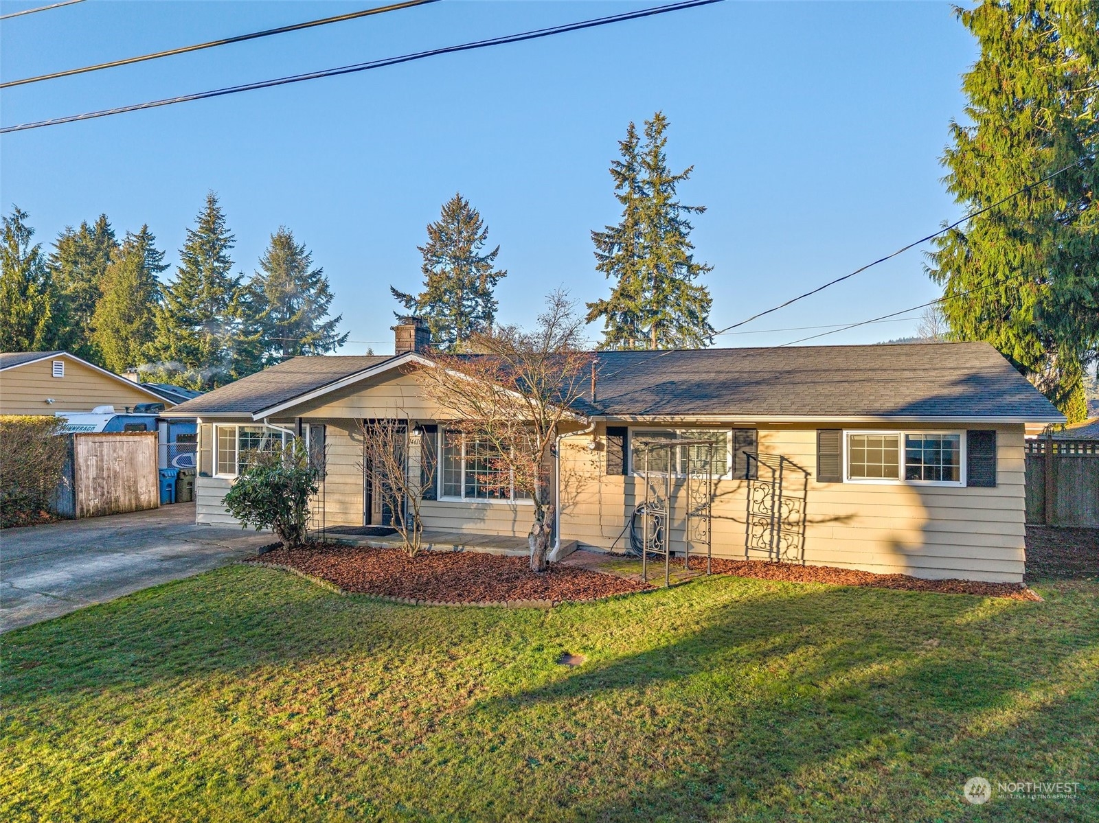 14610 Southeast 113th Street Renton, WA 98059 - Photo 1 of 34 a front view of a house with a yard
