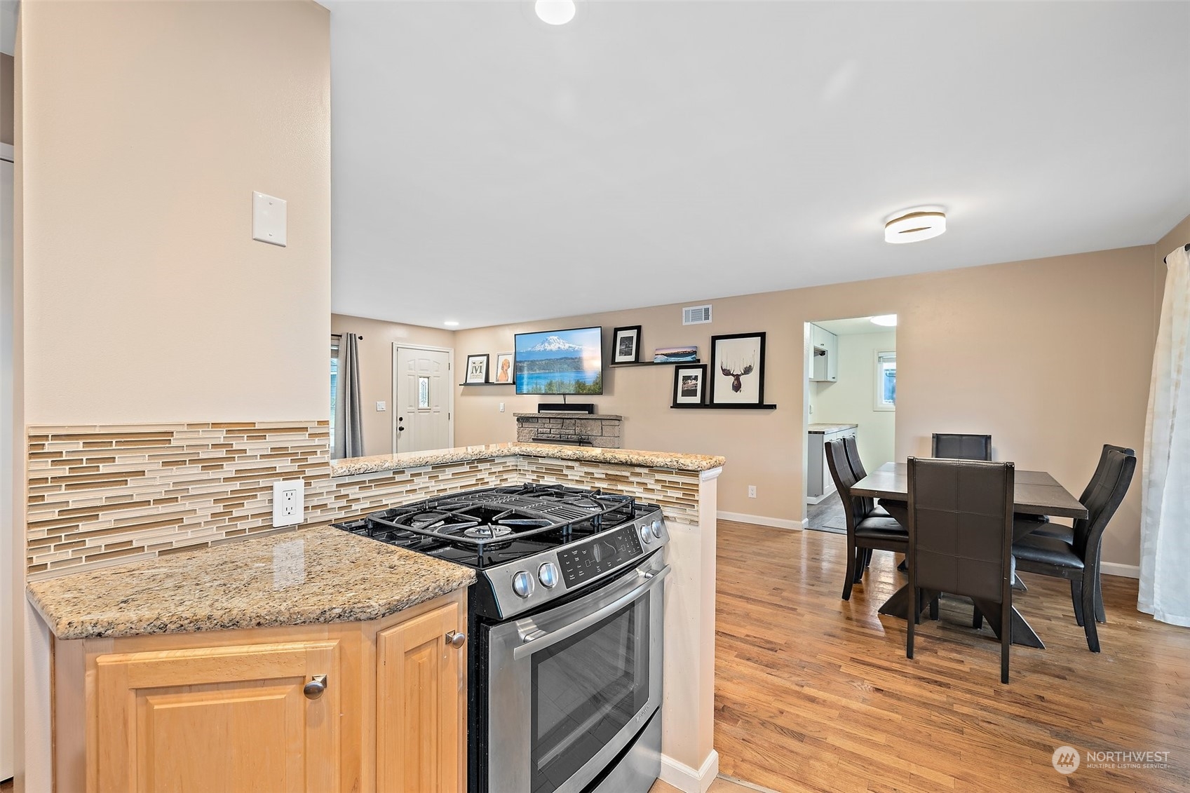 14610 Southeast 113th Street Renton, WA 98059 - Photo 14 of 34 a kitchen with stainless steel appliances granite countertop a stove and a cabinets