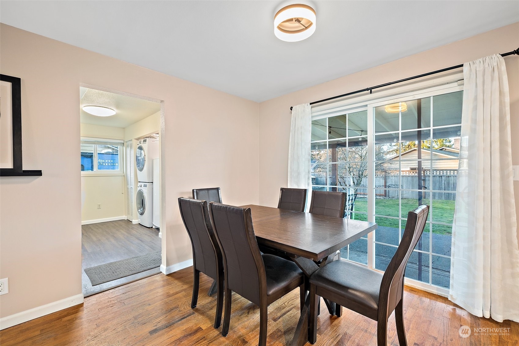 14610 Southeast 113th Street Renton, WA 98059 - Photo 17 of 34 a view of a dining room with furniture and wooden floor