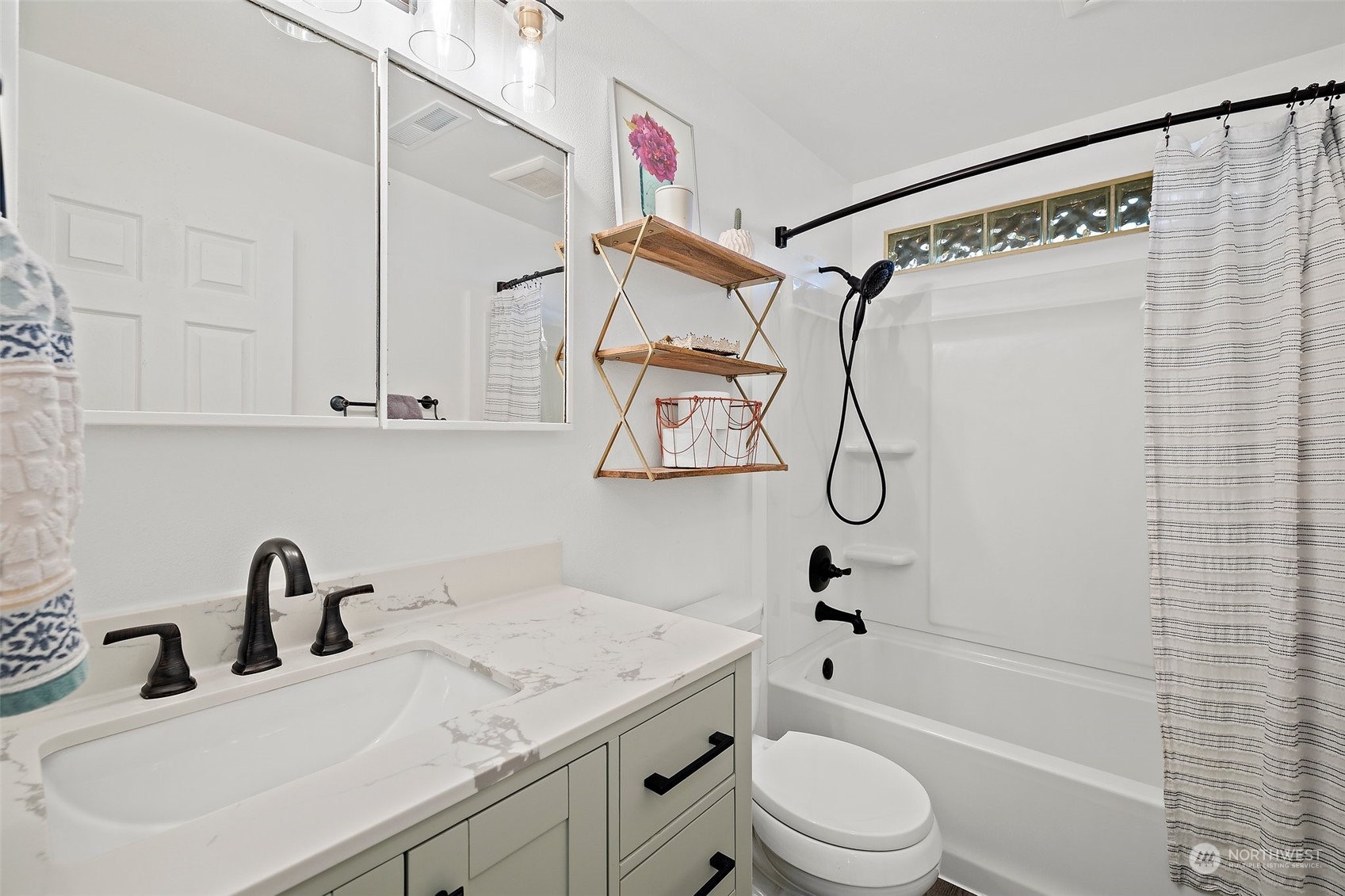 14610 Southeast 113th Street Renton, WA 98059 - Photo 18 of 34 a bathroom with a sink toilet and shower