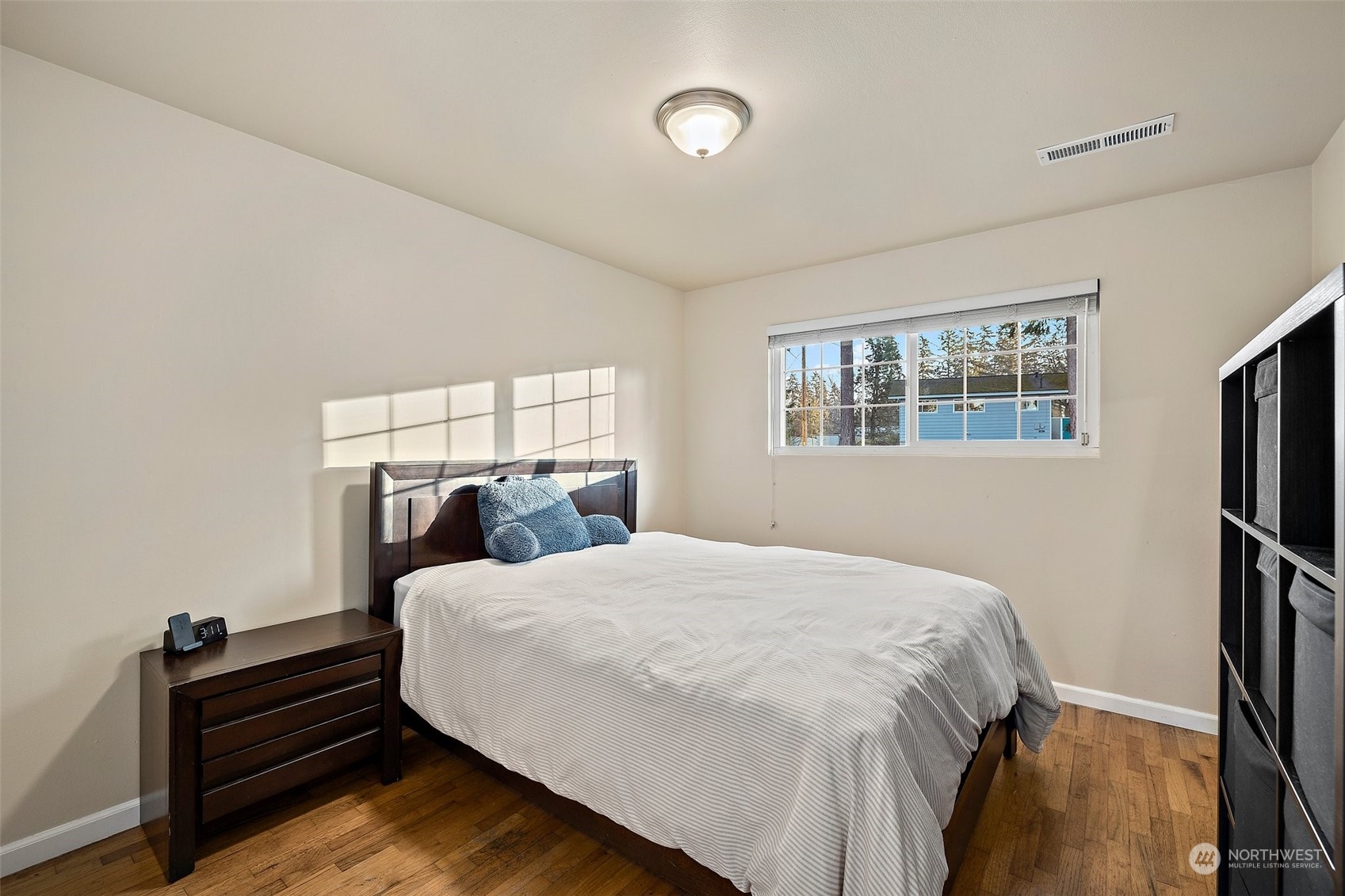14610 Southeast 113th Street Renton, WA 98059 - Photo 20 of 34 a bedroom with a bed and a window