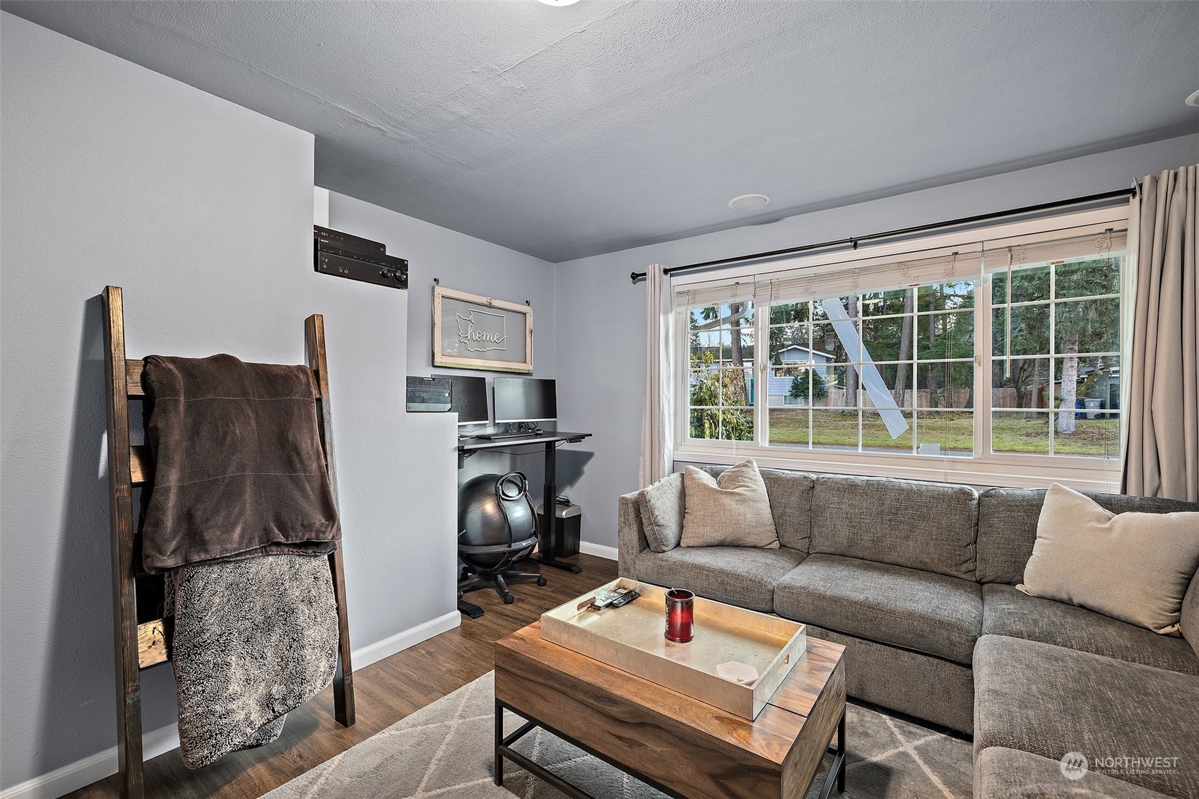 14610 Southeast 113th Street Renton, WA 98059 - Photo 23 of 34 a living room with furniture and a window
