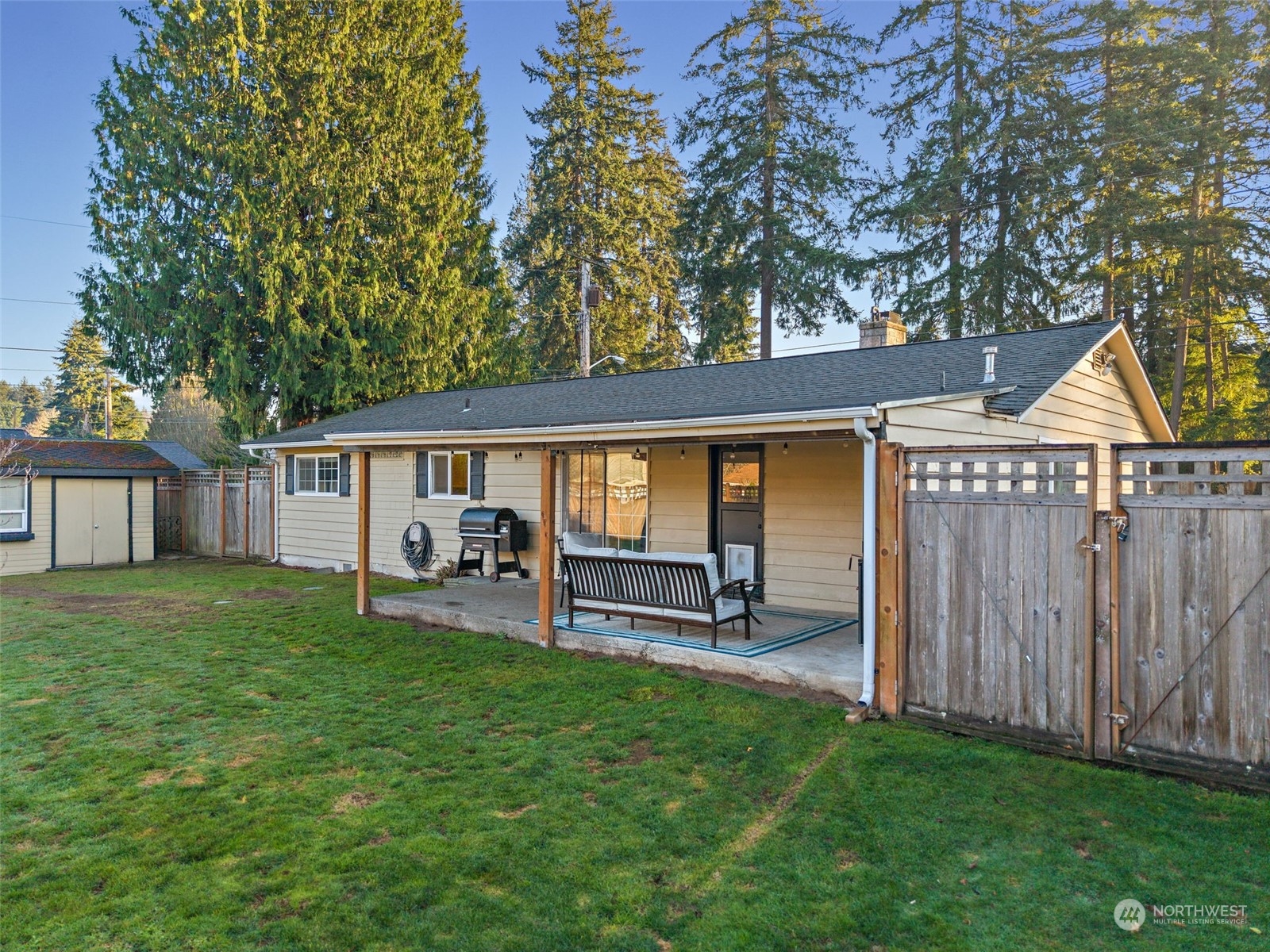 14610 Southeast 113th Street Renton, WA 98059 - Photo 26 of 34 a front view of house with yard and seating area