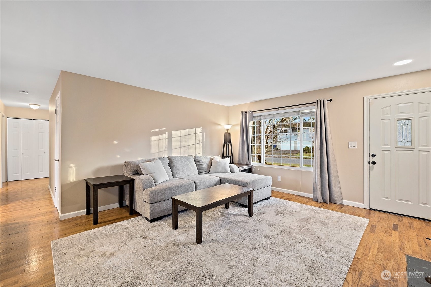 14610 Southeast 113th Street Renton, WA 98059 - Photo 5 of 34 a living room with furniture and a window