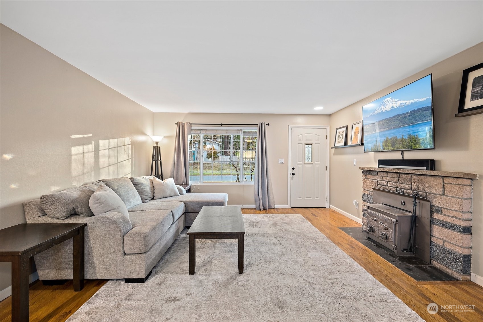 14610 Southeast 113th Street Renton, WA 98059 - Photo 6 of 34 a living room with furniture and a fireplace