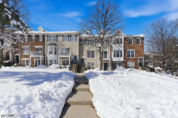 a view of a building with a yard