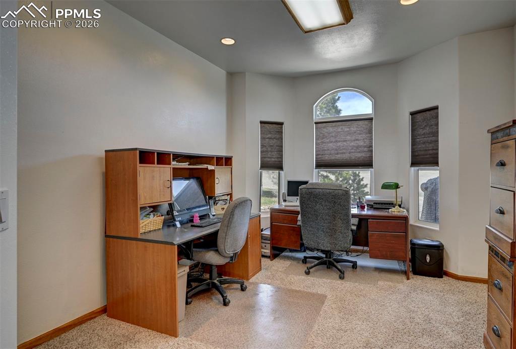 5910 McCart Ranch Circle Elizabeth, CO 80107 - Photo 19 of 50 a view of a workspace with furniture and a window