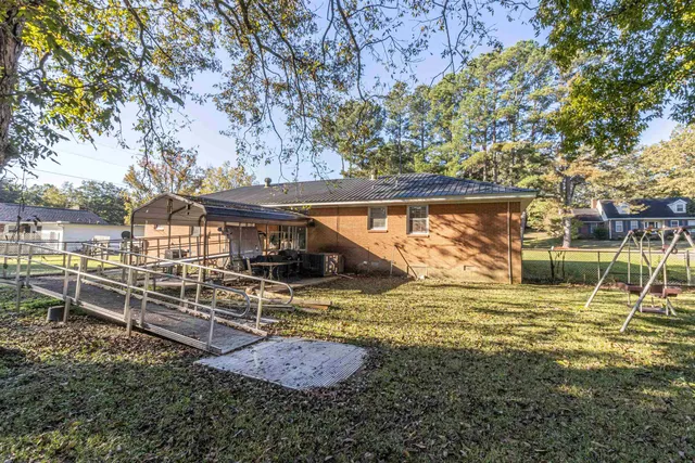 a view of a yard with a tree