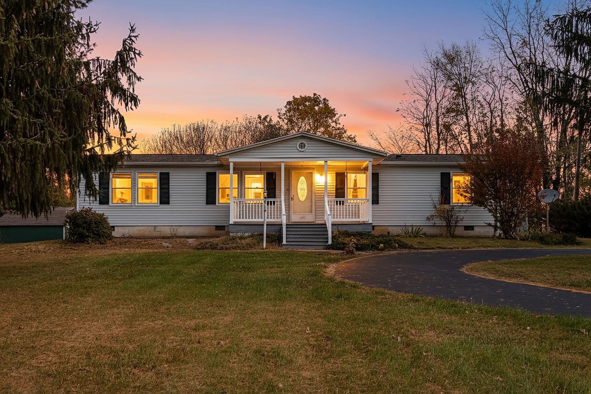 a view of a house with a yard