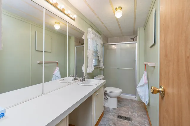 a kitchen with stainless steel appliances a stove a sink and a microwave