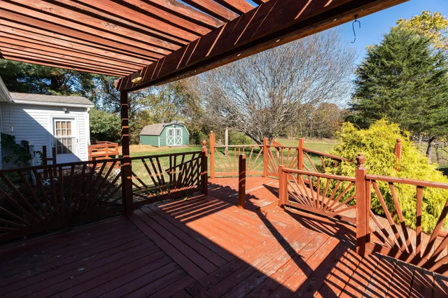 a view of a house with a yard and swimming pool