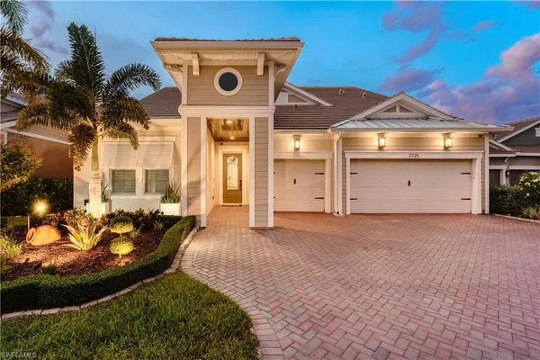 a view of a house with a yard and garage