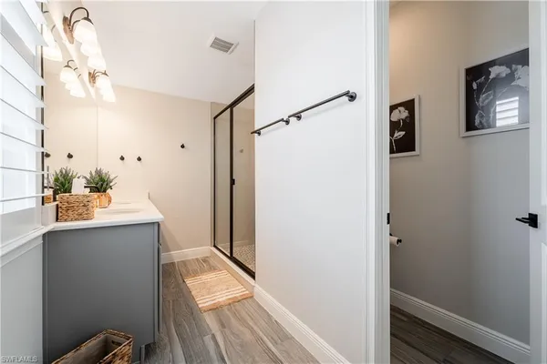 a bathroom with a sink and mirror