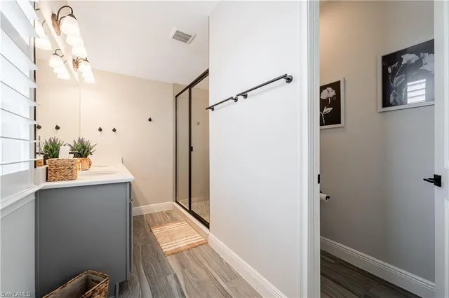 a bathroom with a sink and mirror