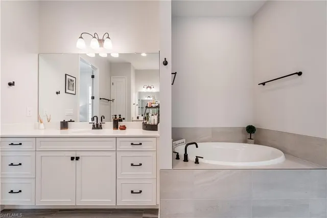 a bathroom with a bathtub and a sink