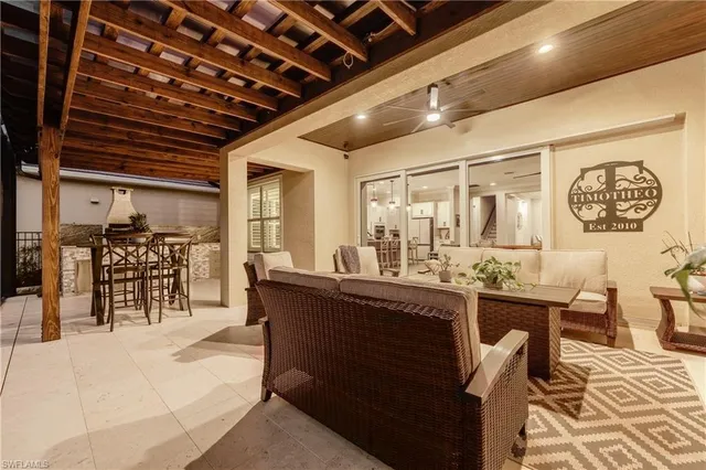 a living room with lots of wooden furniture