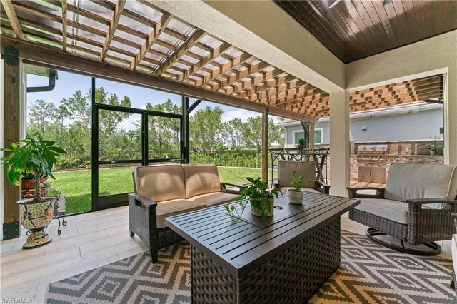 a outdoor living space with patio furniture and garden view