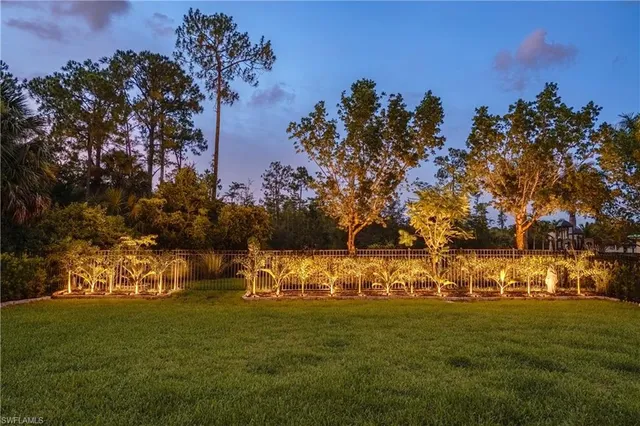 a view of a golf course with the trees