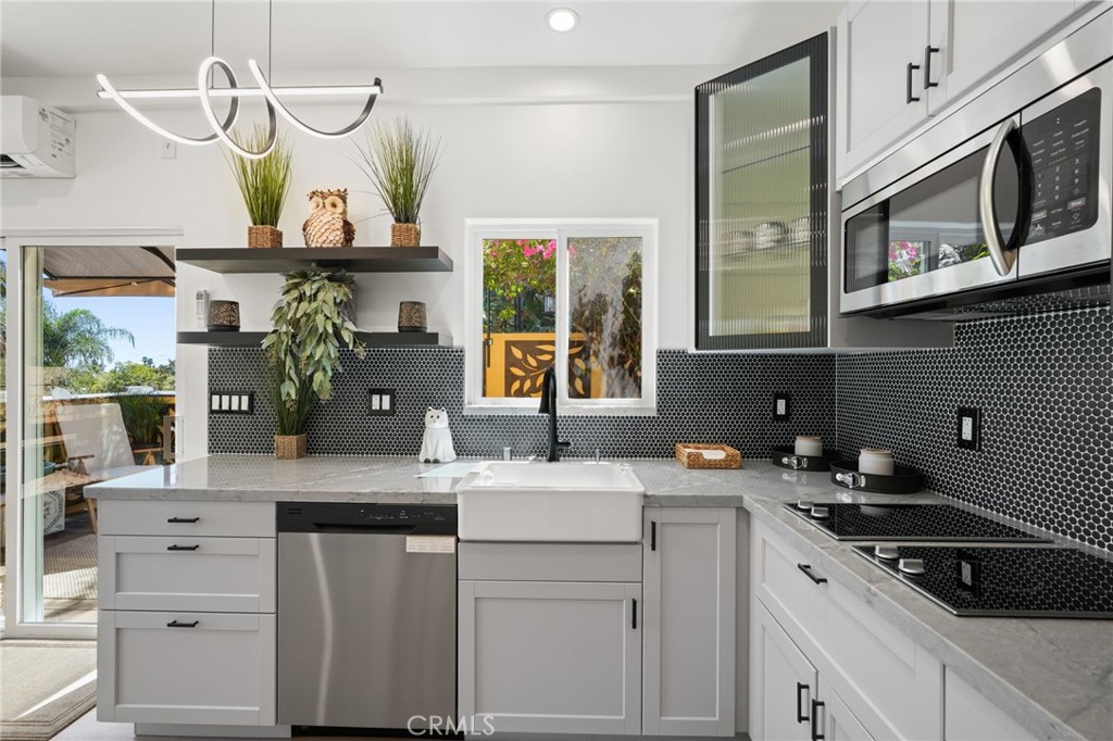 2258 Helios Drive Los Angeles, CA 90068 - Photo 4 of 27 a kitchen with a sink cabinets and window