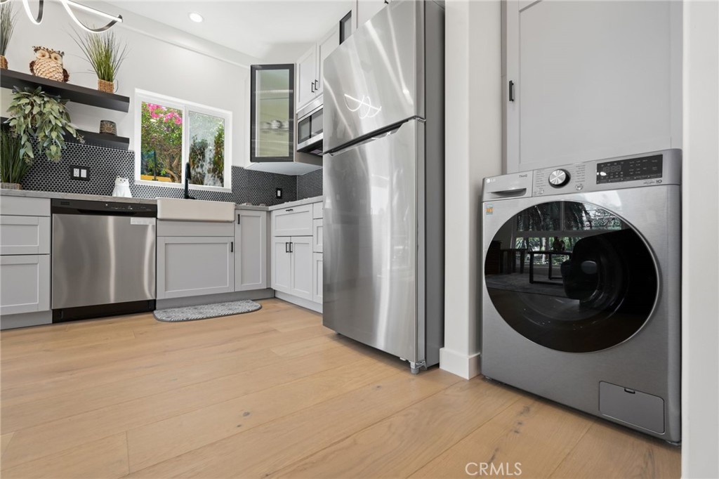 2258 Helios Drive Los Angeles, CA 90068 - Photo 5 of 27 a view of a kitchen with washer and dryer