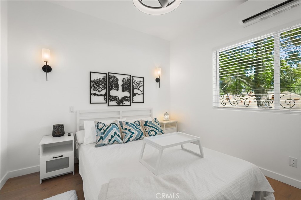 2258 Helios Drive Los Angeles, CA 90068 - Photo 6 of 27 a bedroom with a bed and a window