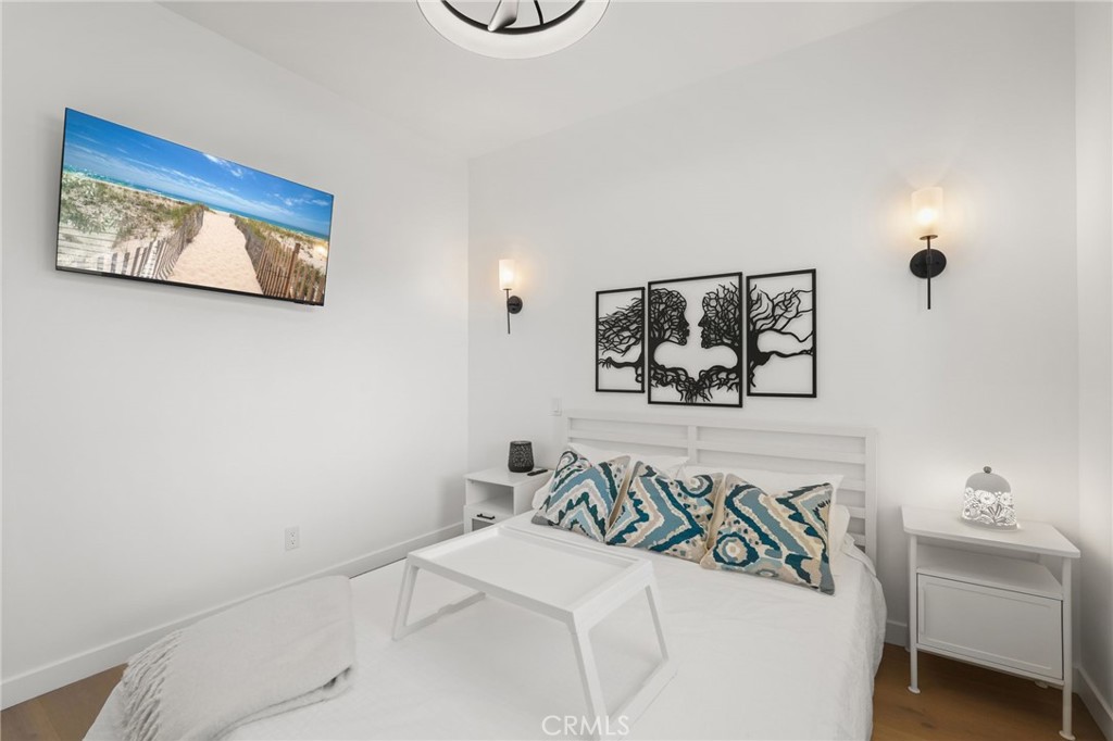 2258 Helios Drive Los Angeles, CA 90068 - Photo 7 of 27 a bedroom with a bed and a painting on the wall