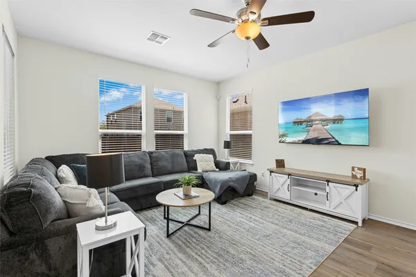 a living room with furniture and a large window