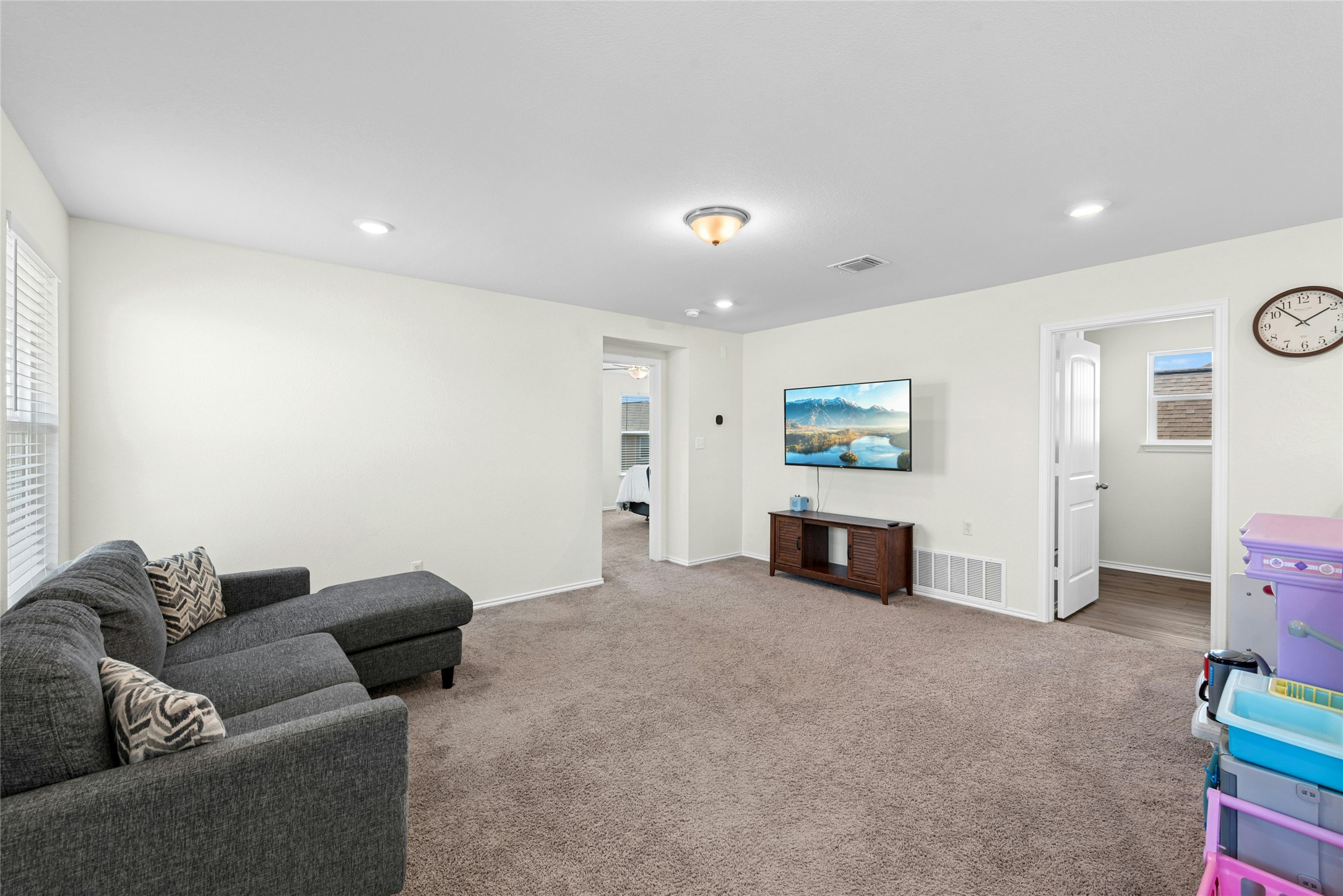 1124 Aronia Lane Georgetown, TX 78626 - Photo 15 of 31 a living room with furniture and a flat screen tv
