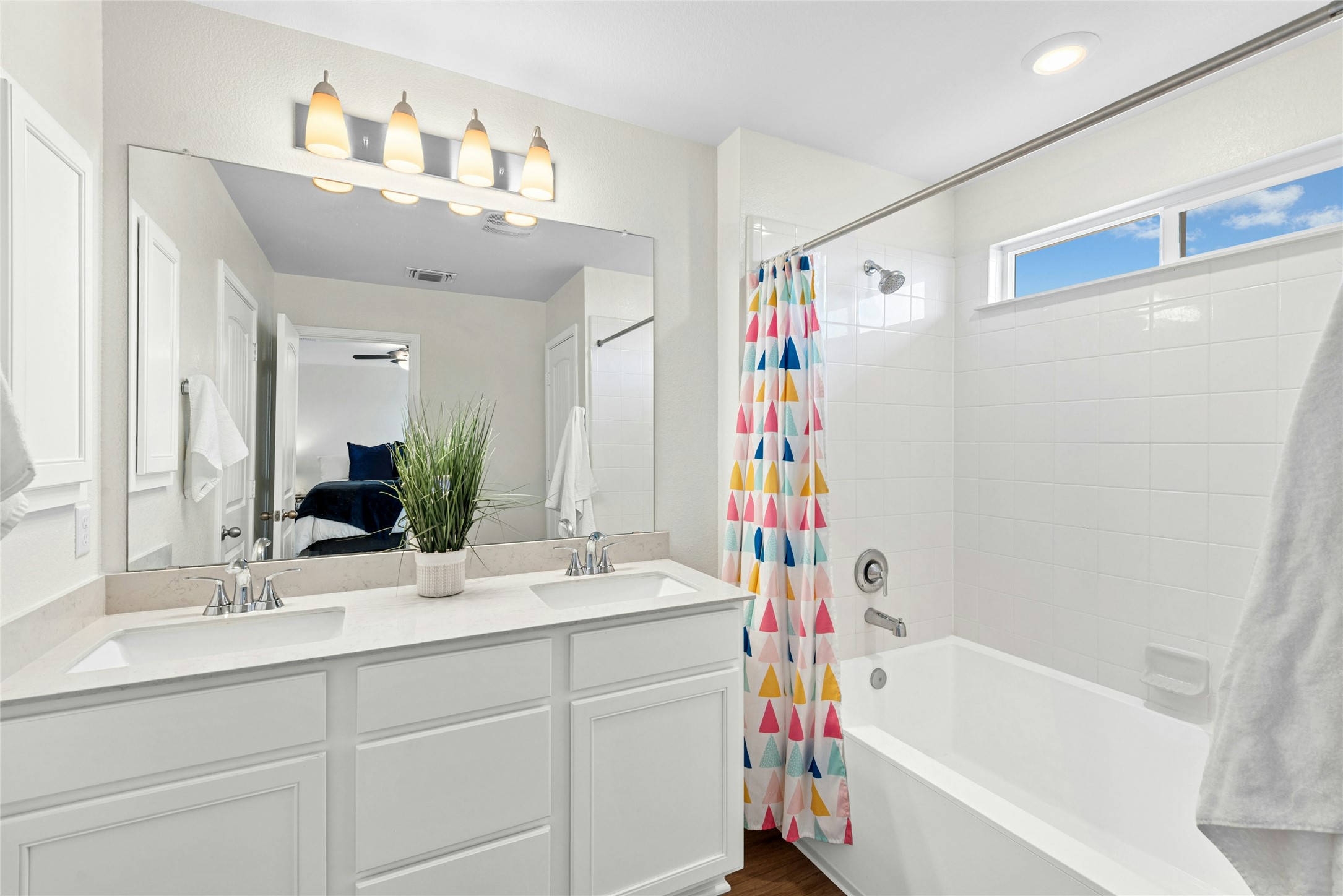 1124 Aronia Lane Georgetown, TX 78626 - Photo 18 of 31 a bathroom with a double vanity sink mirror and bathtub