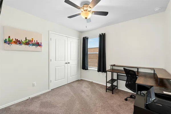 a bedroom with furniture and a window