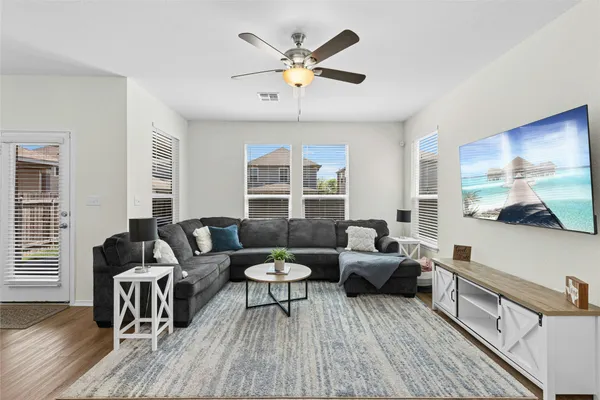 a living room with furniture and a large window