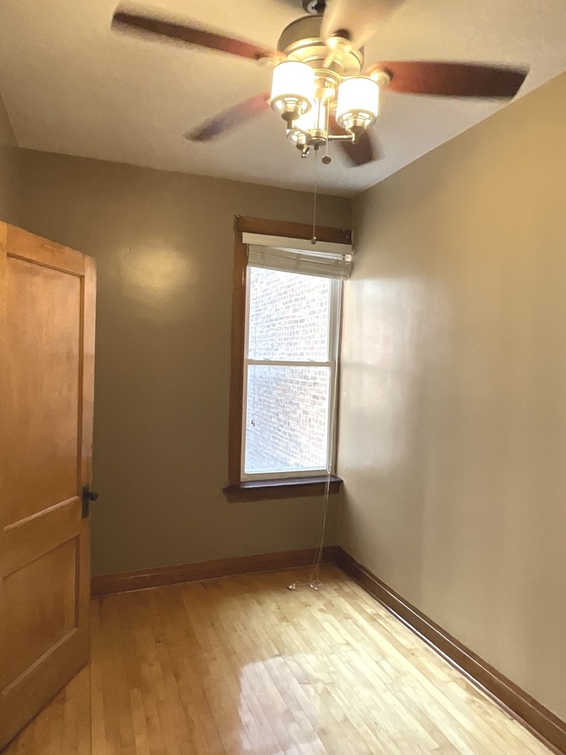 919 North Leavitt Street, Unit 2F Chicago, IL 60622 - Photo 12 of 18 a view of an empty room and a window