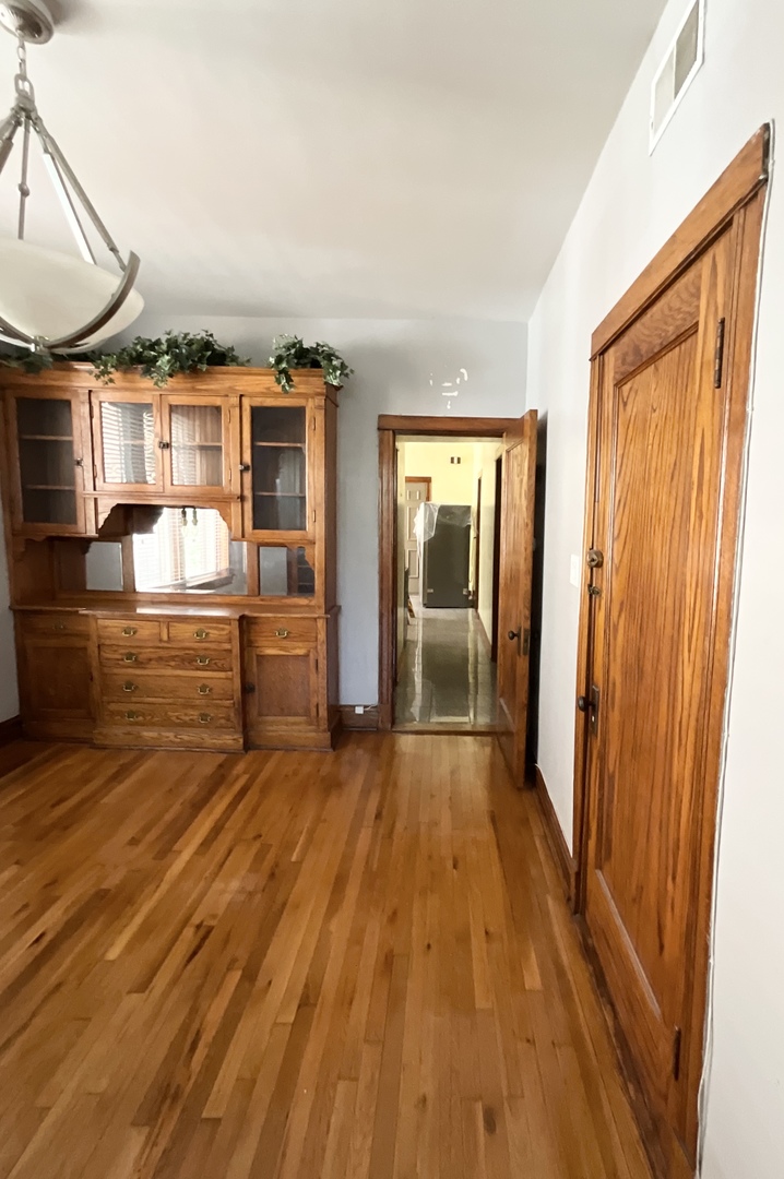 919 North Leavitt Street, Unit 2F Chicago, IL 60622 - Photo 3 of 18 a view of empty room with wooden floor and fan