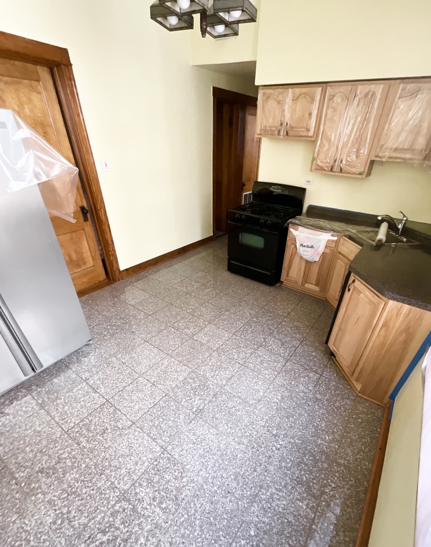 919 North Leavitt Street, Unit 2F Chicago, IL 60622 - Photo 5 of 18 a view of an empty room and wooden floor