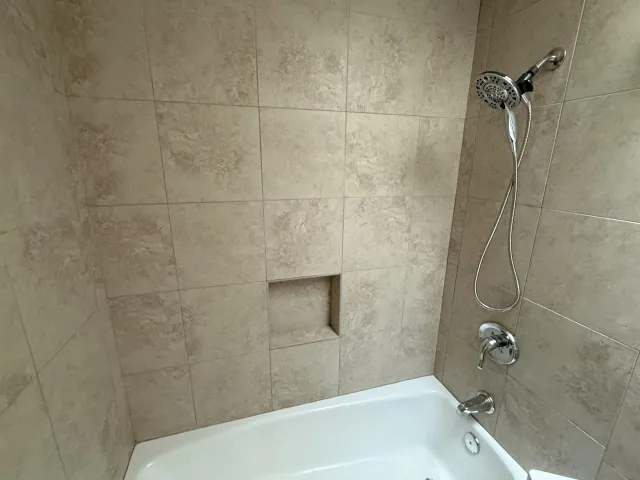 a white toilet sitting next to a sink