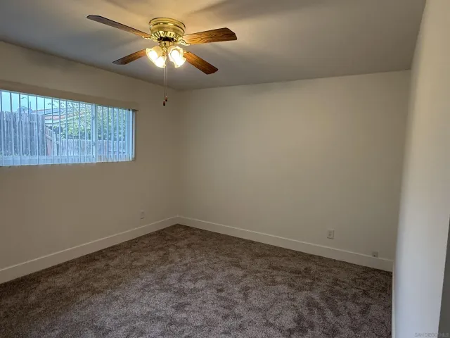 a bathroom with a shower and a sink